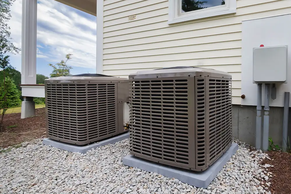 Outdoor condenser units beside a house